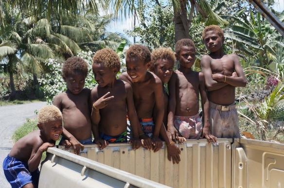 We stopped to buy some crafts from the local Matupit people - got this awesome shot of some local kids climbing on the back of the ute
